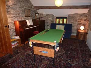 Games room with piano, double futon & small snooker table