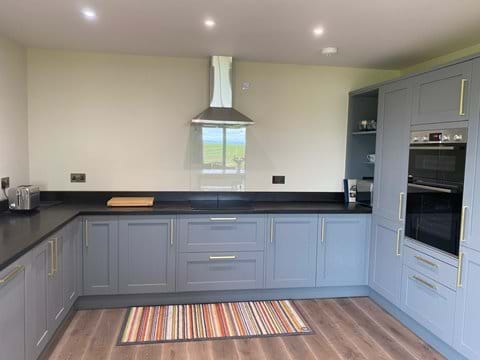 The kitchen area in the open-plan living space
