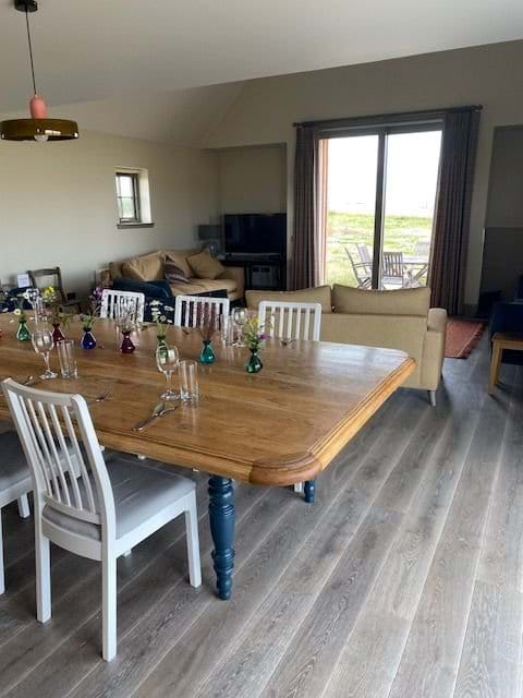 Dining and living areas with the sliding doors on the NW gable, Photo taken from the kitchen area