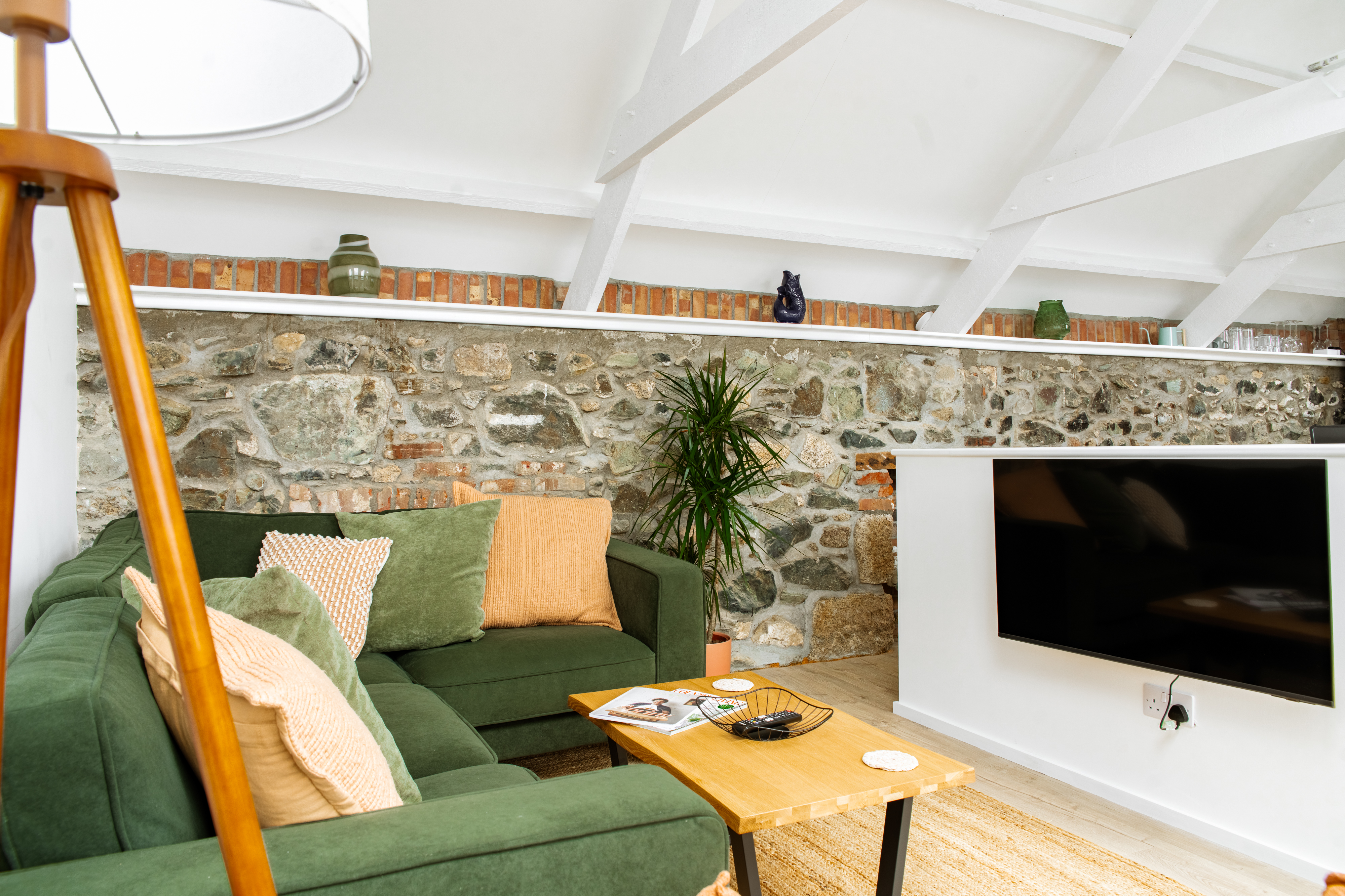 Open plan living room with comfy sofa and armchair