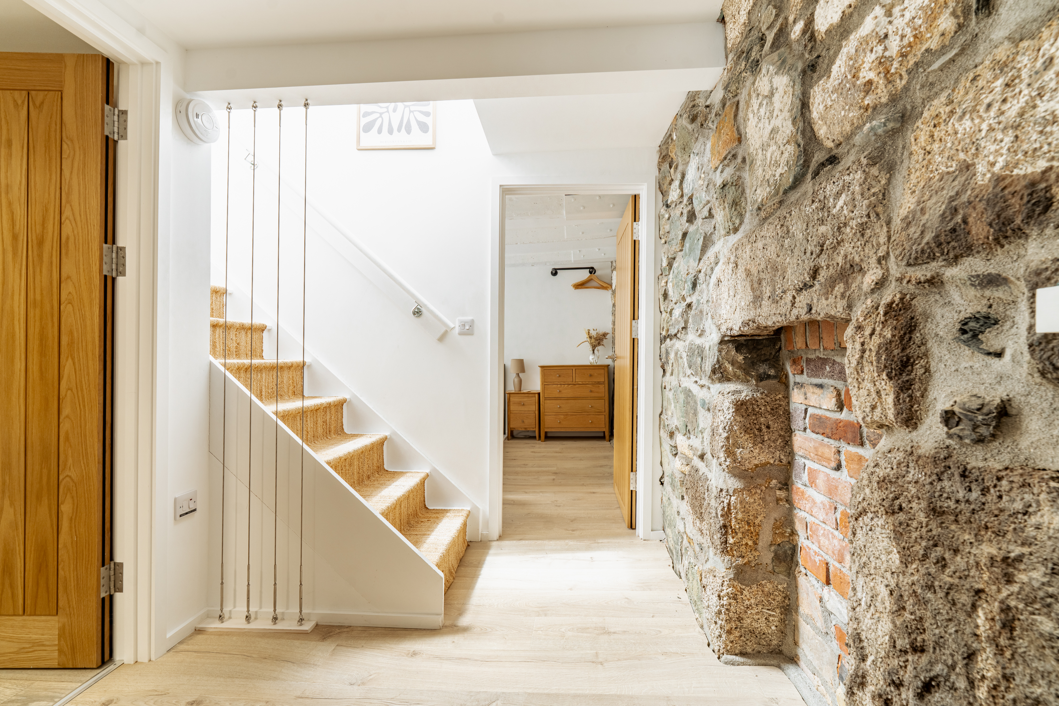 Stairs leading to kitchen and living room
