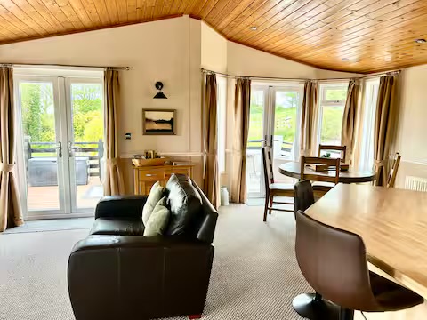 Our open plan living space, with two sets of double doors lead onto enclosed decking