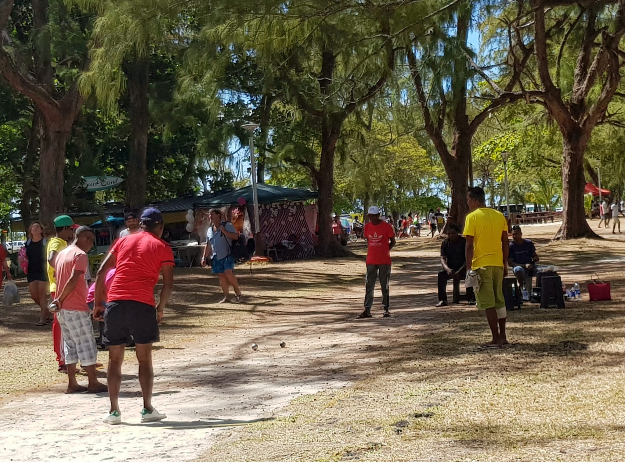 Watching the locals enjoying a game of petanque on the beach