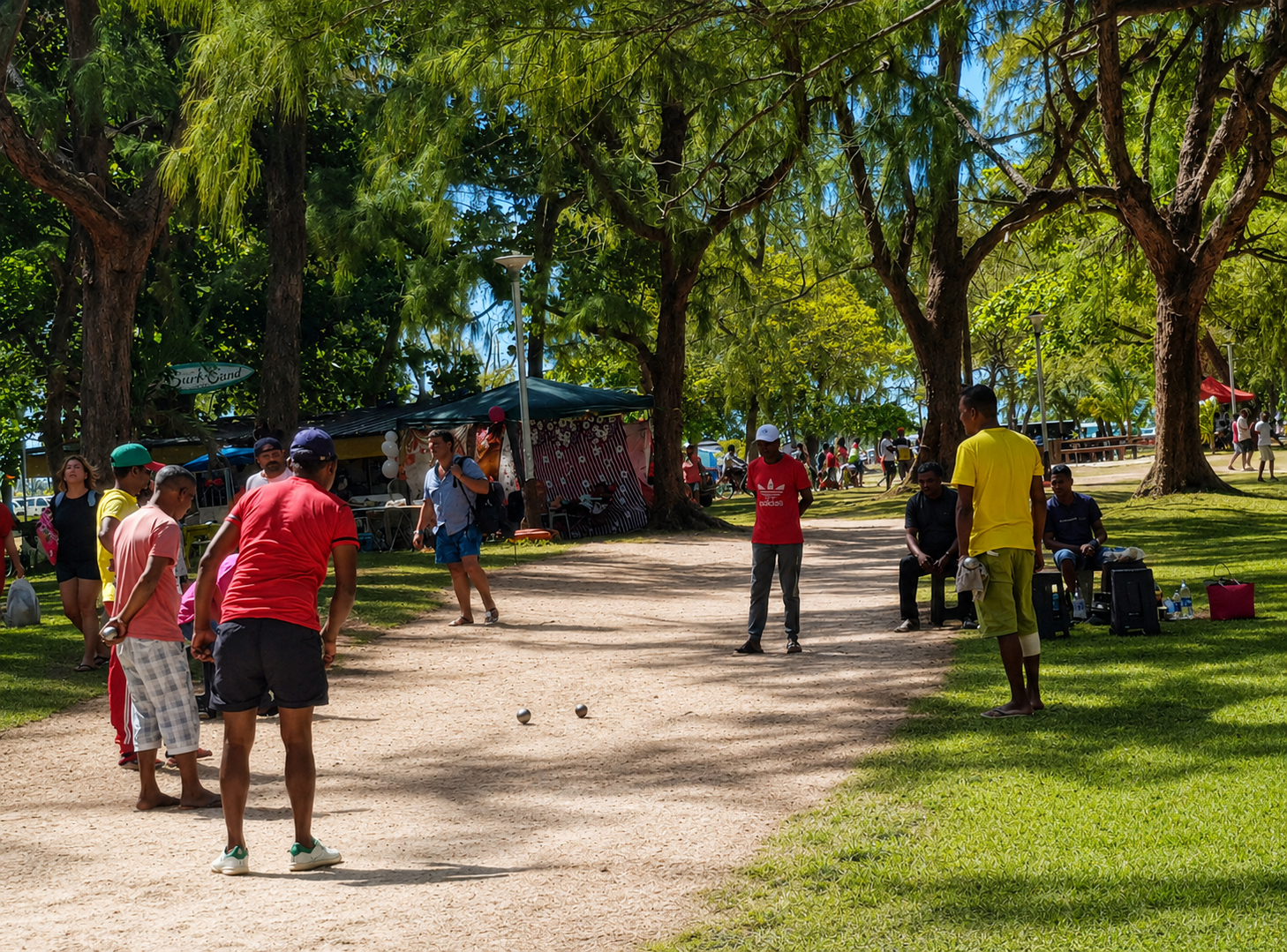 Watching the locals enjoying a game of petanque on the beach