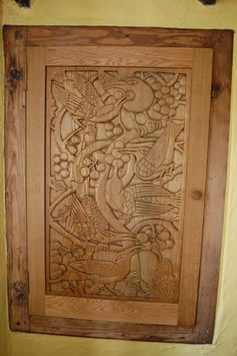 The hand carved oak cupboard in the lounge