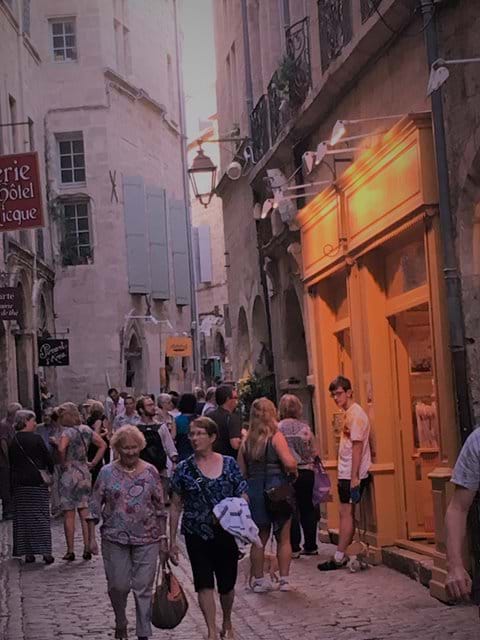 Late night shopping in the old town of Pézenas