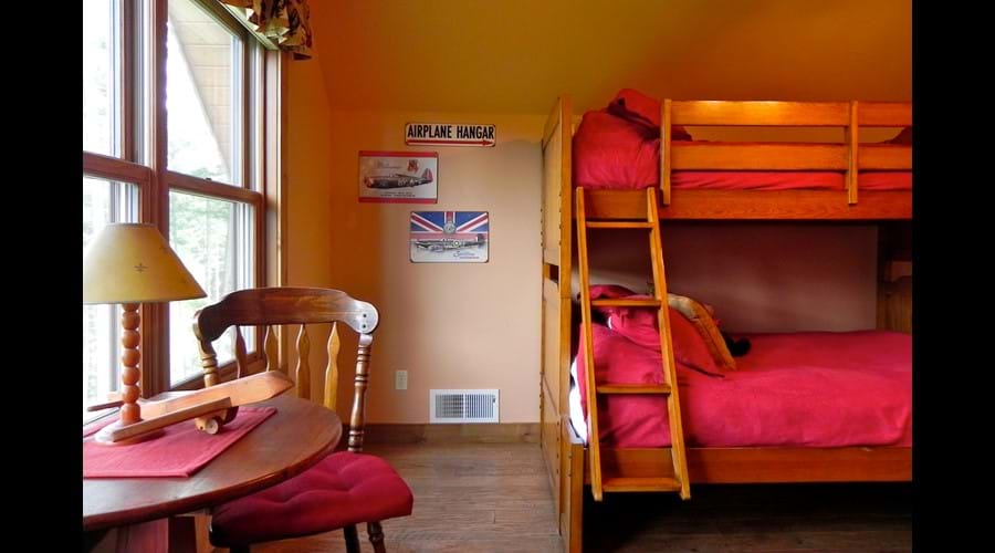 Queen/twin bunk bed in "Take Flight" aviation upstairs bedroom