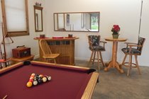 Professional grade pool table and bar area in 1/2 of attached garage