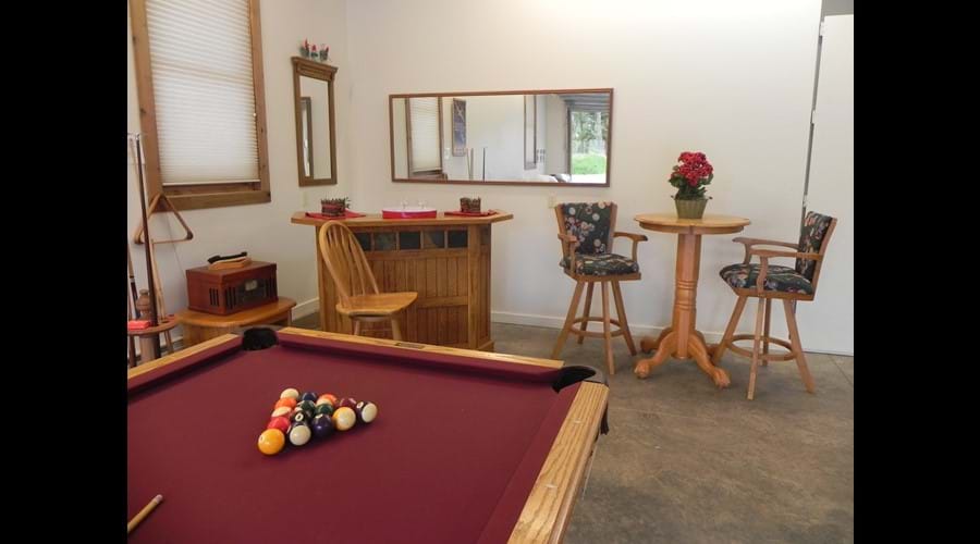 Professional grade pool table and bar area in 1/2 of attached garage