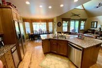 Open floor plan kitchen faces great room and deck