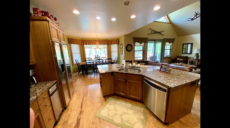 Open floor plan kitchen faces great room and deck
