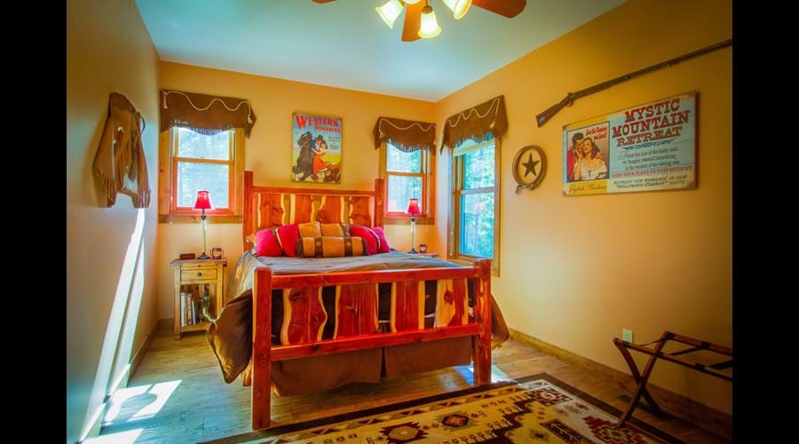 "Hollywood Cowboy" bedroom with queen log bed