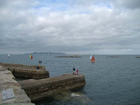 Take the Dart to Dalkey and take a ferry trip to the island in summer see http://www.visitdublin.com/discover-dalkey-an-illustrated-guide