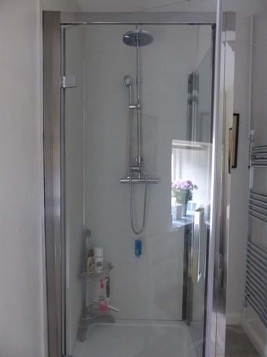 Shower enclosure in downstairs cloakroom