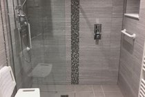 Disabled friendly ensuite wetroom to groundfloor double with thermostatic shower and shower chair