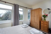 Groundfloor Double Bedroom with chest of drawers, wardrobe and bedside tables