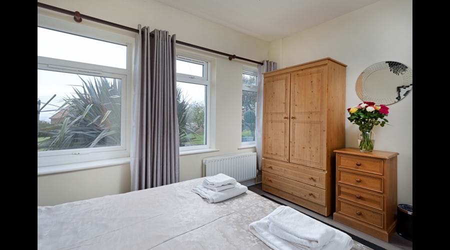 Groundfloor Double Bedroom with chest of drawers, wardrobe and bedside tables