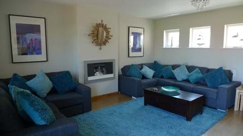 Large sitting room with lots of comfortable seating