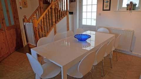 White gloss table seating 10 people