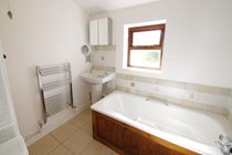 Bathroom with bath and free standing shower