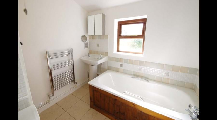 Bathroom with bath and free standing shower